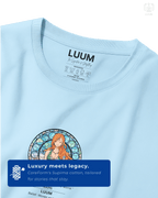 Closeup detail of Nami’s front emblem design with stained-glass style art and quote on Baby Blue Supima cotton. Part of DailyPrints Collection. Belief. Woven and Worn.
