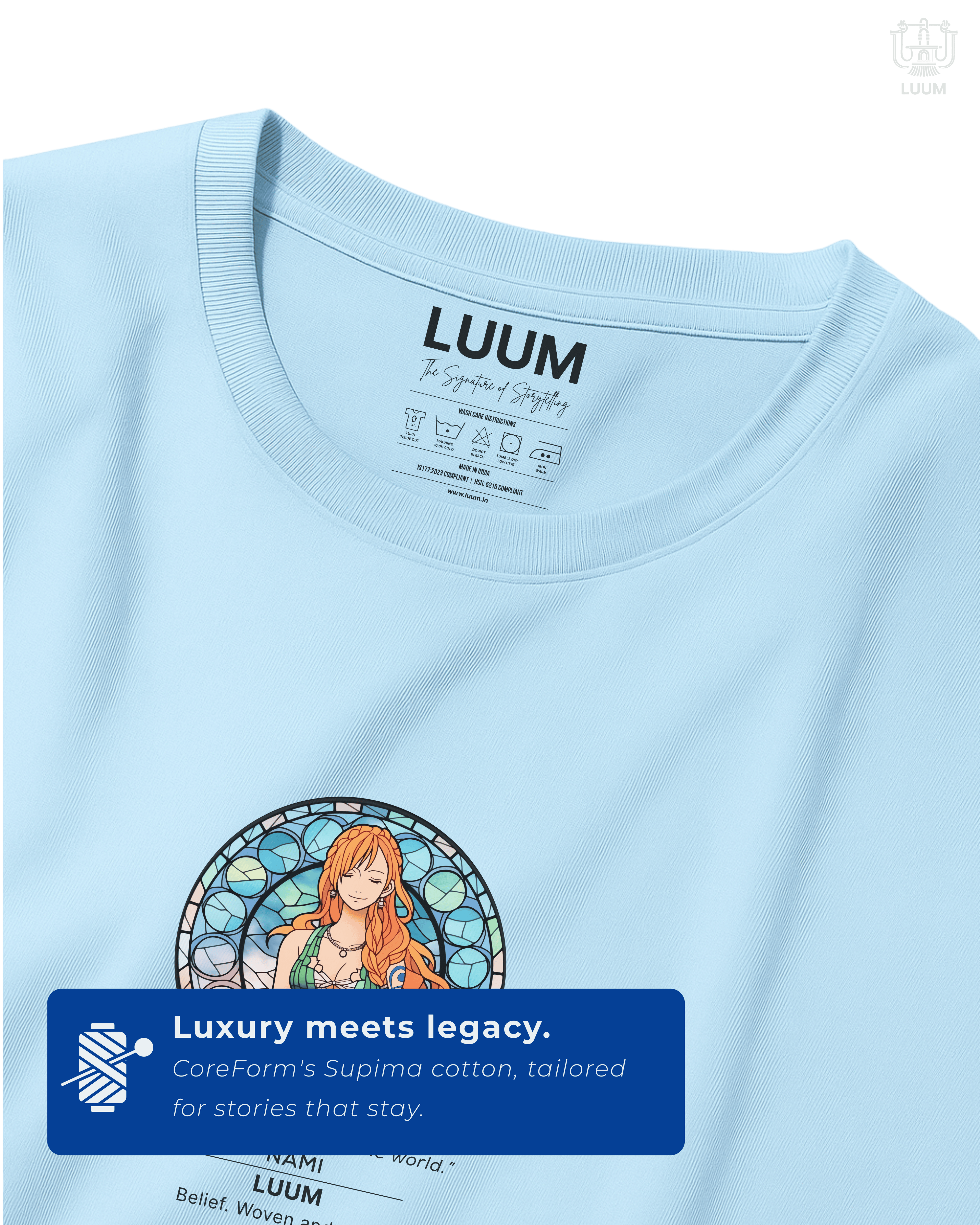 Closeup detail of Nami’s front emblem design with stained-glass style art and quote on Baby Blue Supima cotton. Part of DailyPrints Collection. Belief. Woven and Worn.