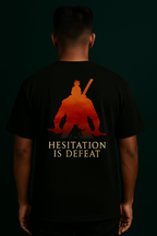LUUM's Black oversized t-shirt featuring a red-orange silhouette of a kneeling samurai with the quote “Hesitation is Defeat” printed below. Part of DailyPrints Collection. Belief. Woven and Worn.