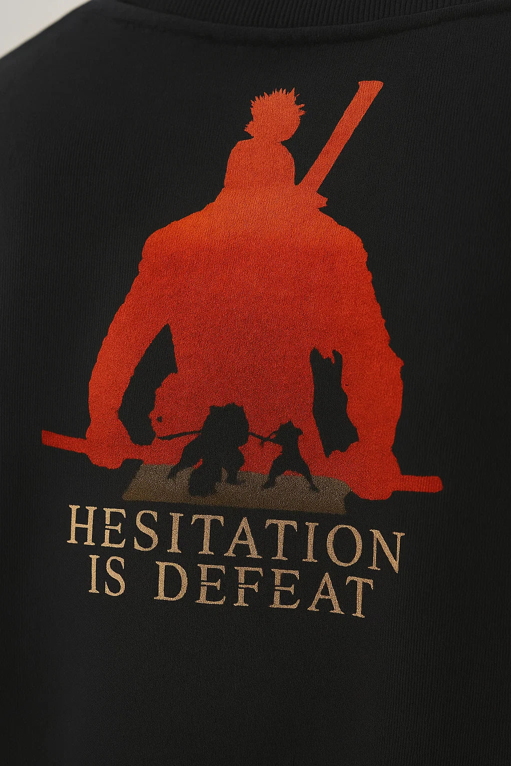 LUUM's Macro close-up of the samurai silhouette and “Hesitation is Defeat” quote printed on black cotton, highlighting DTG texture. Part of DailyPrints Collection. Belief. Woven and Worn.