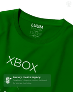 Fabric close-up of green Xbox Series X tee highlighting LUUM’s Supima cotton texture and printed tag detail. Part of DailyPrints Collection. Belief. Woven and Worn.