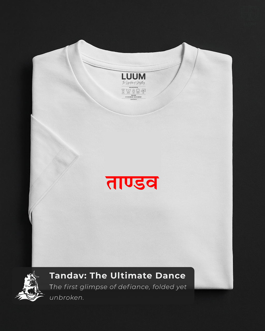 Folded white LUUM's Tandav t-shirt featuring bold red Sanskrit script, crafted in premium cotton. Part of Threadmark Collection. Belief. Woven and Worn.