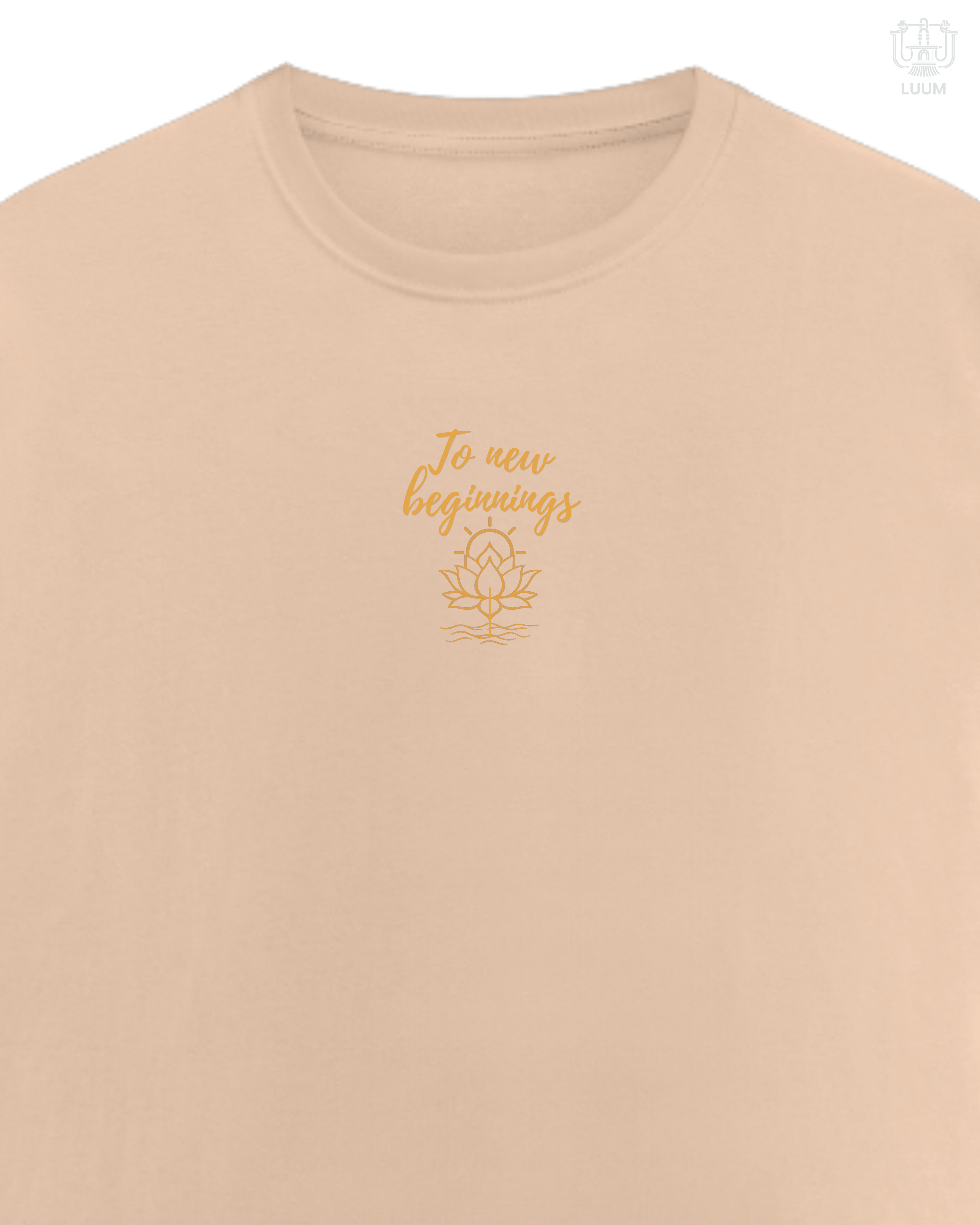 LUUM To New Beginnings embroidered Supima cotton tee in peach pastel shade with lotus detail. Part of Threadmark Collection. Belief. Woven and Worn.